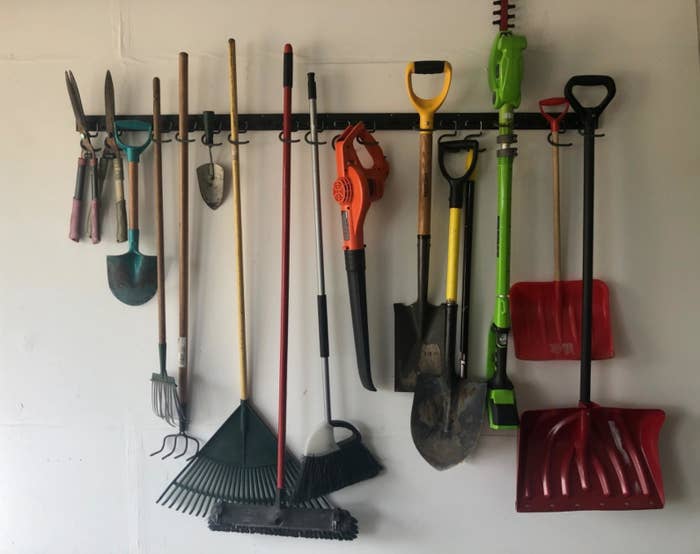 the same garage organized neartly with the steel hooks