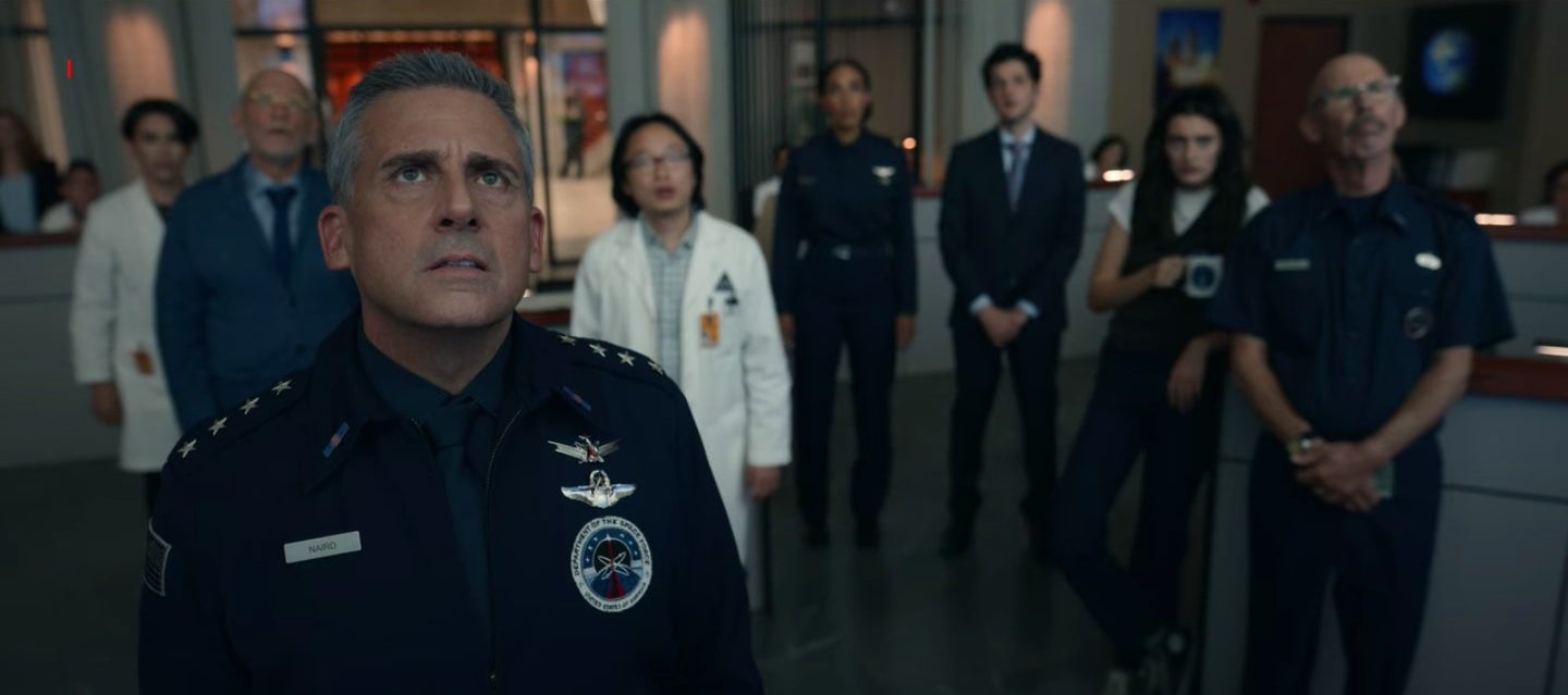 Naird and co. staring up at the computer screen in "Space Force"