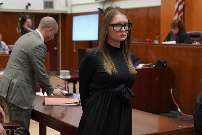 The real Anna Delvey leaving a courtroom dressed in all black