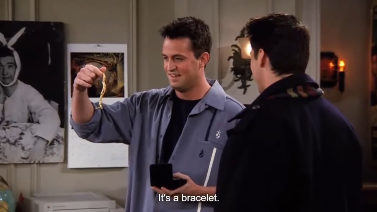 Chandler holding a gold bracelet in &quot;Friends&quot;