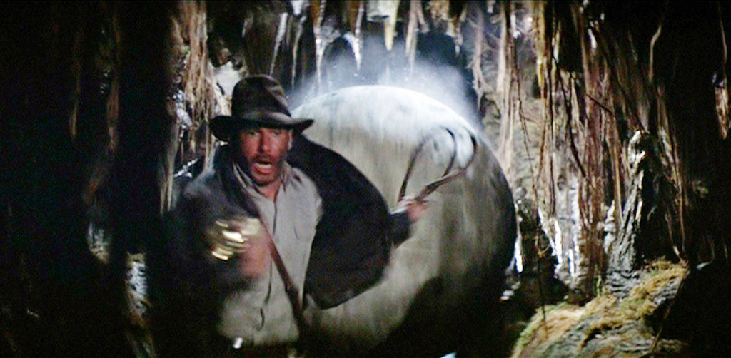 Indiana Jones runs from rolling boulder