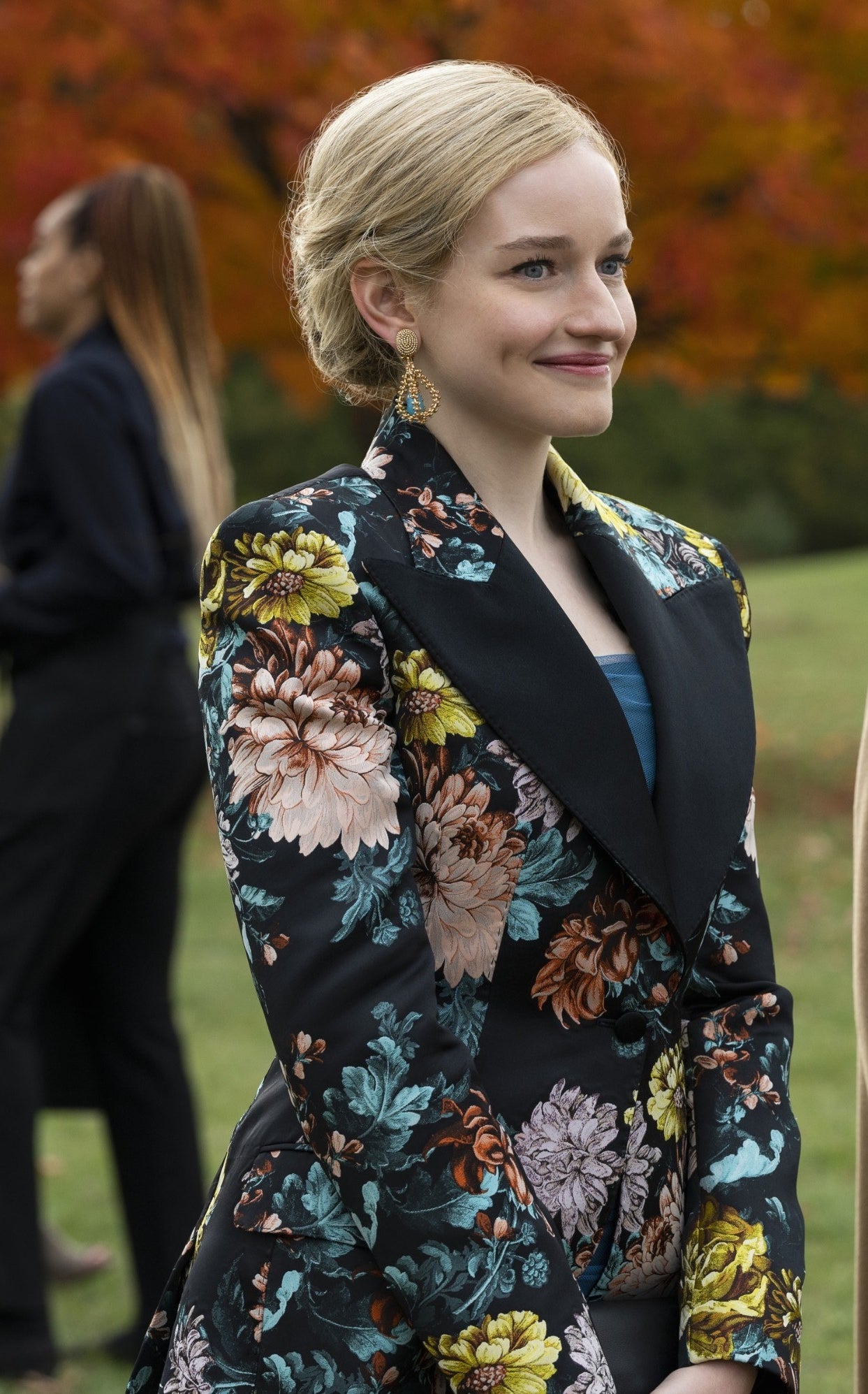 Anna wears a structured floral suit
