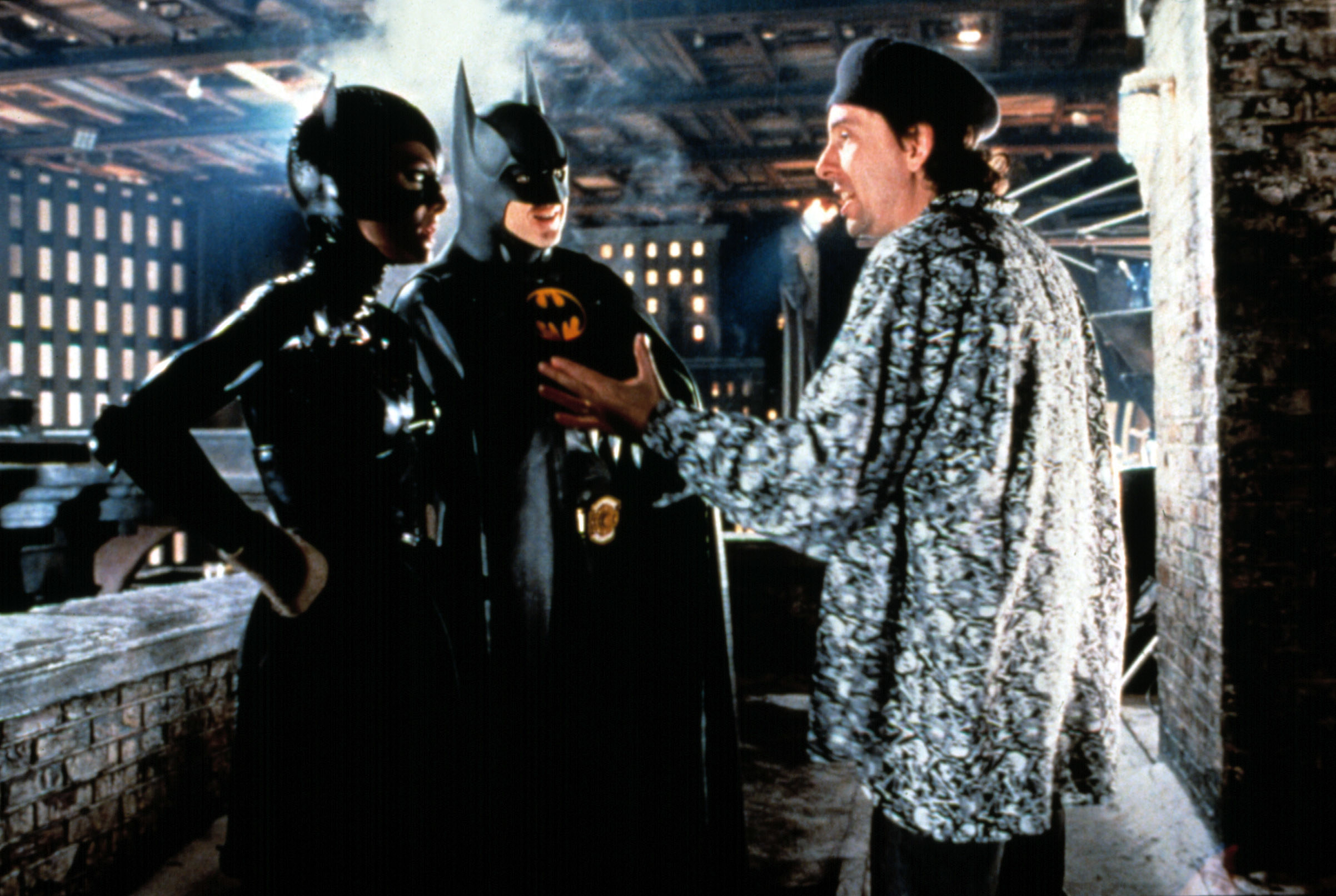 Michelle Pfeiffer, Michael Keaton with director Tim Burton on the set, 1992