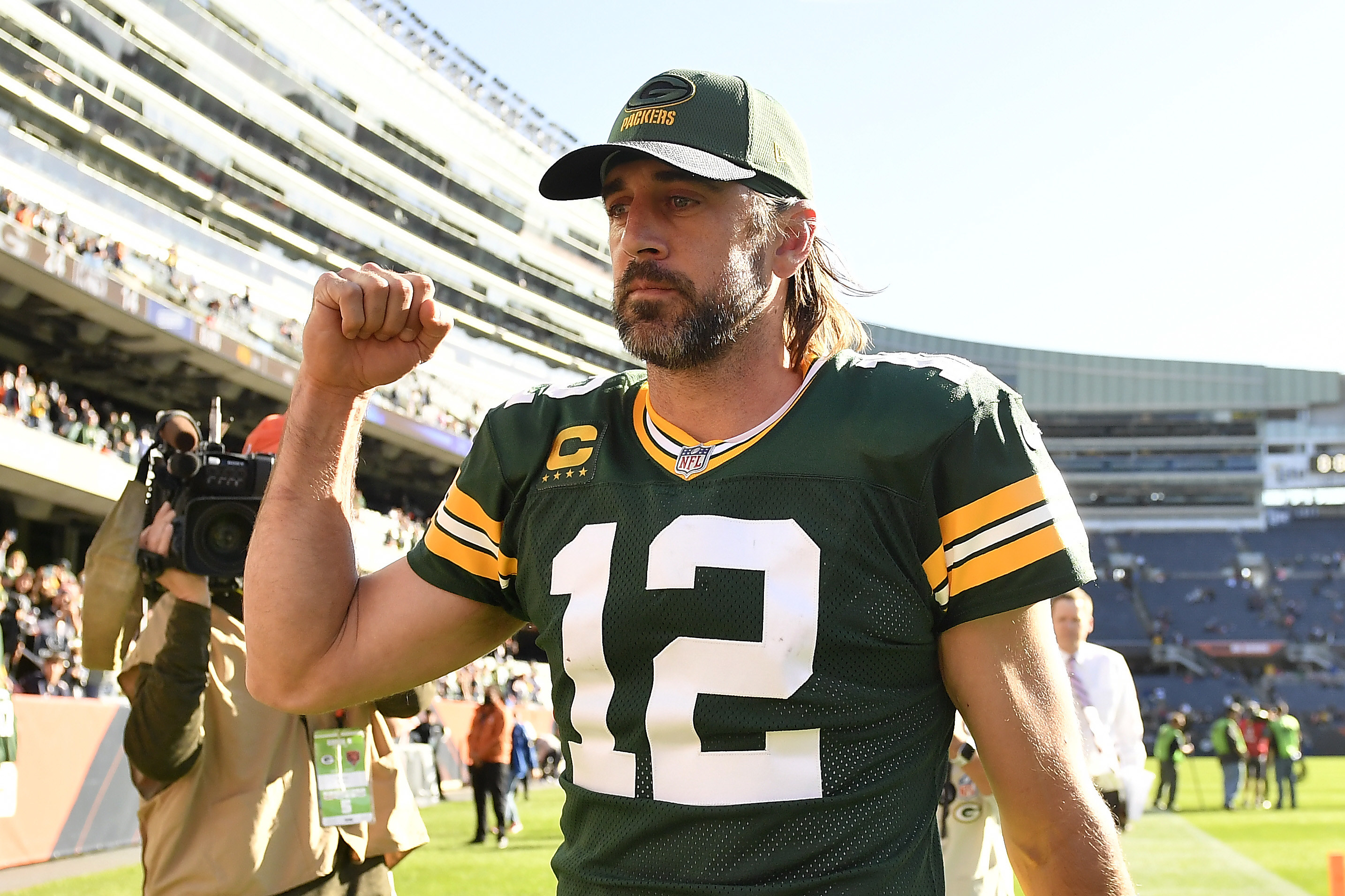 Rodgers puts his fist up while walking