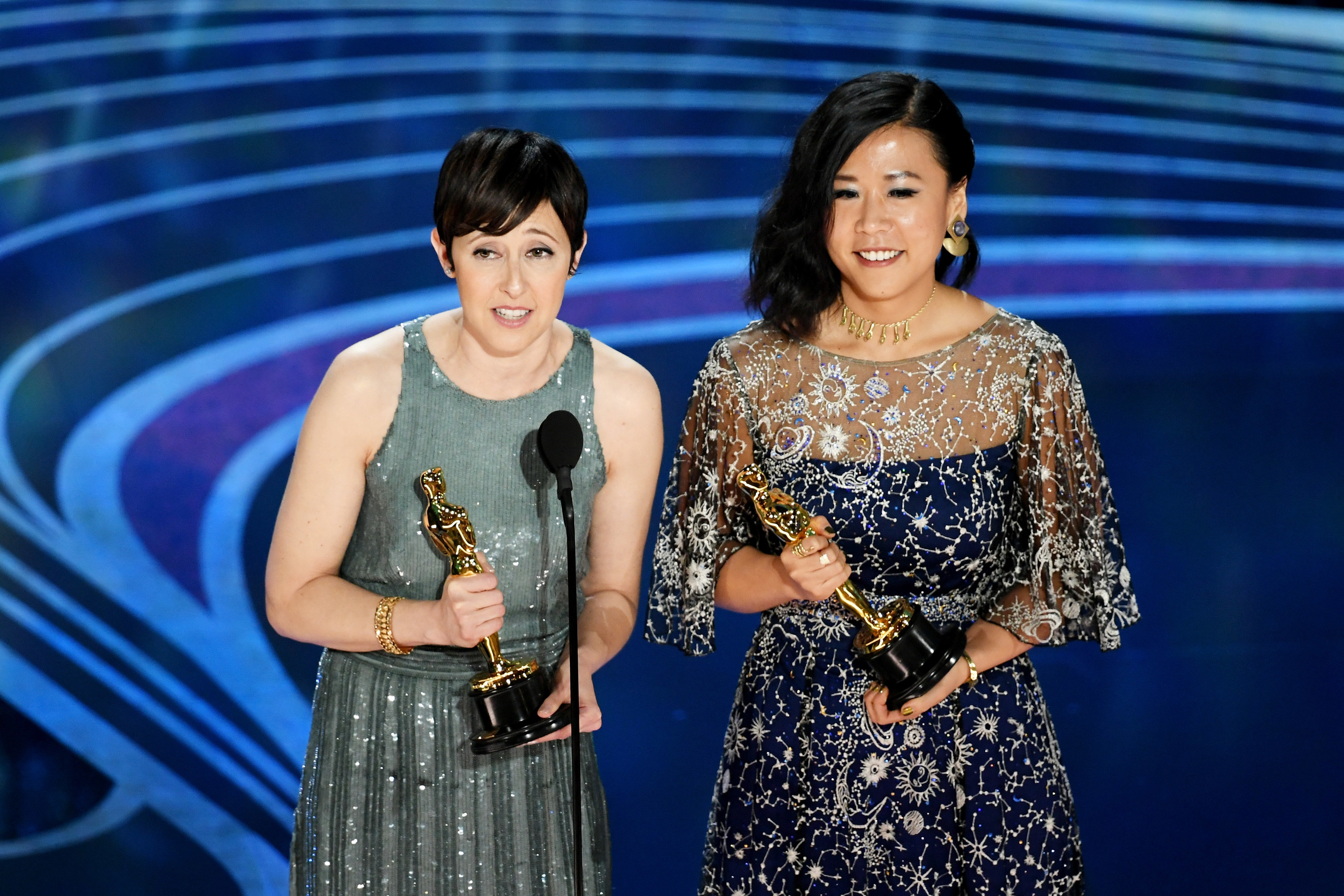 Becky Neiman-Cobb and Domee Shi hold their Oscars