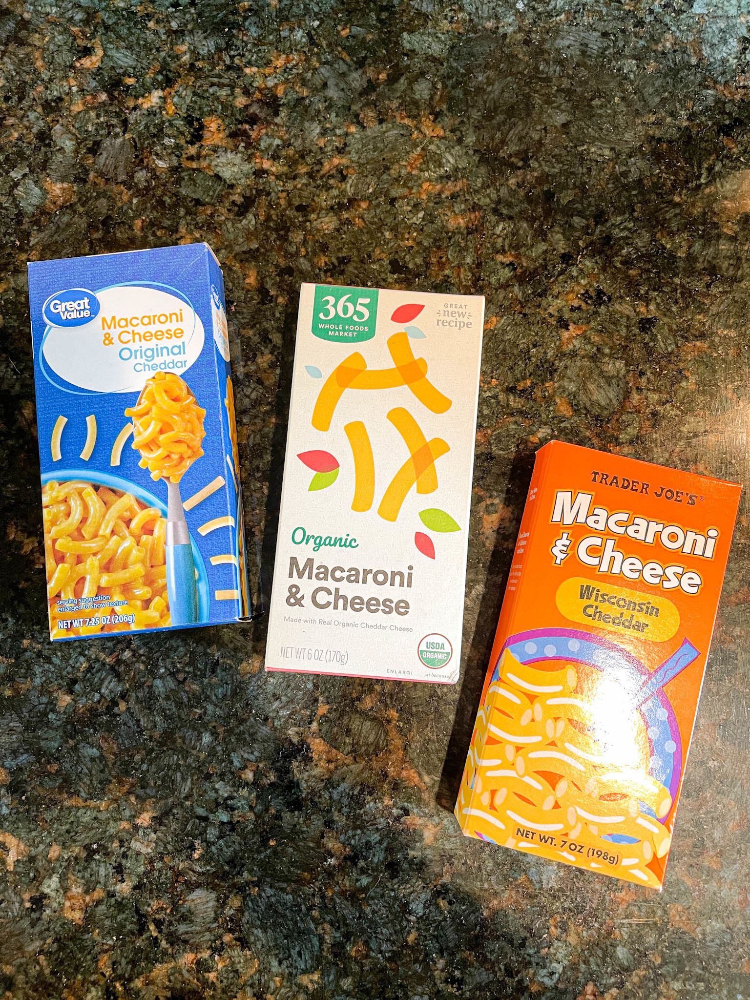 Three mac &#x27;n&#x27; cheese boxes: Walmart&#x27;s, Whole Foods, and Trader Joe&#x27;s