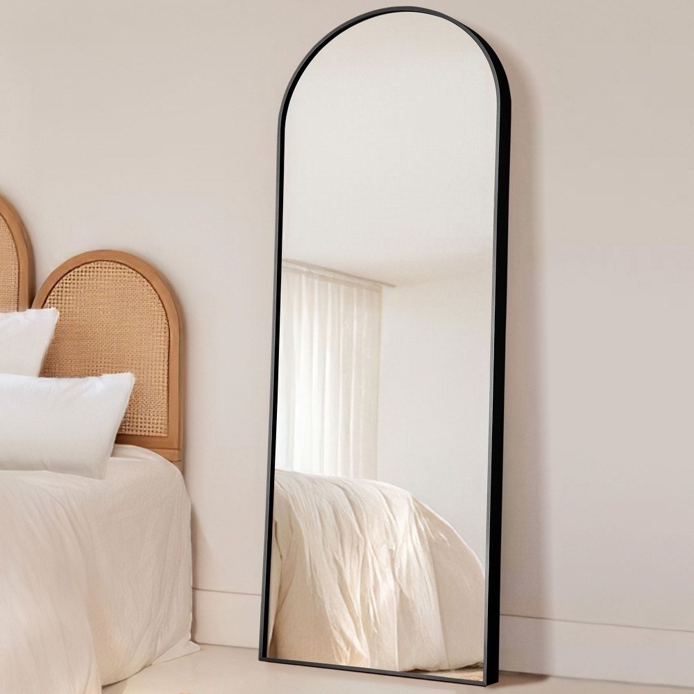 the arched mirror with a black frame