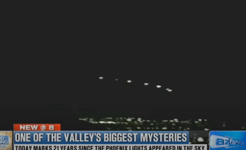 screen shot of news story with lights flying in formation over Phoenix