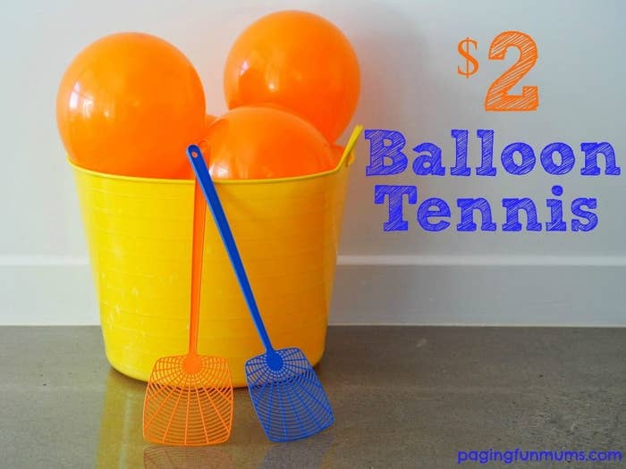 Blogger&#x27;s photo of orange balloons in a yellow bucket and a pair of fly swats