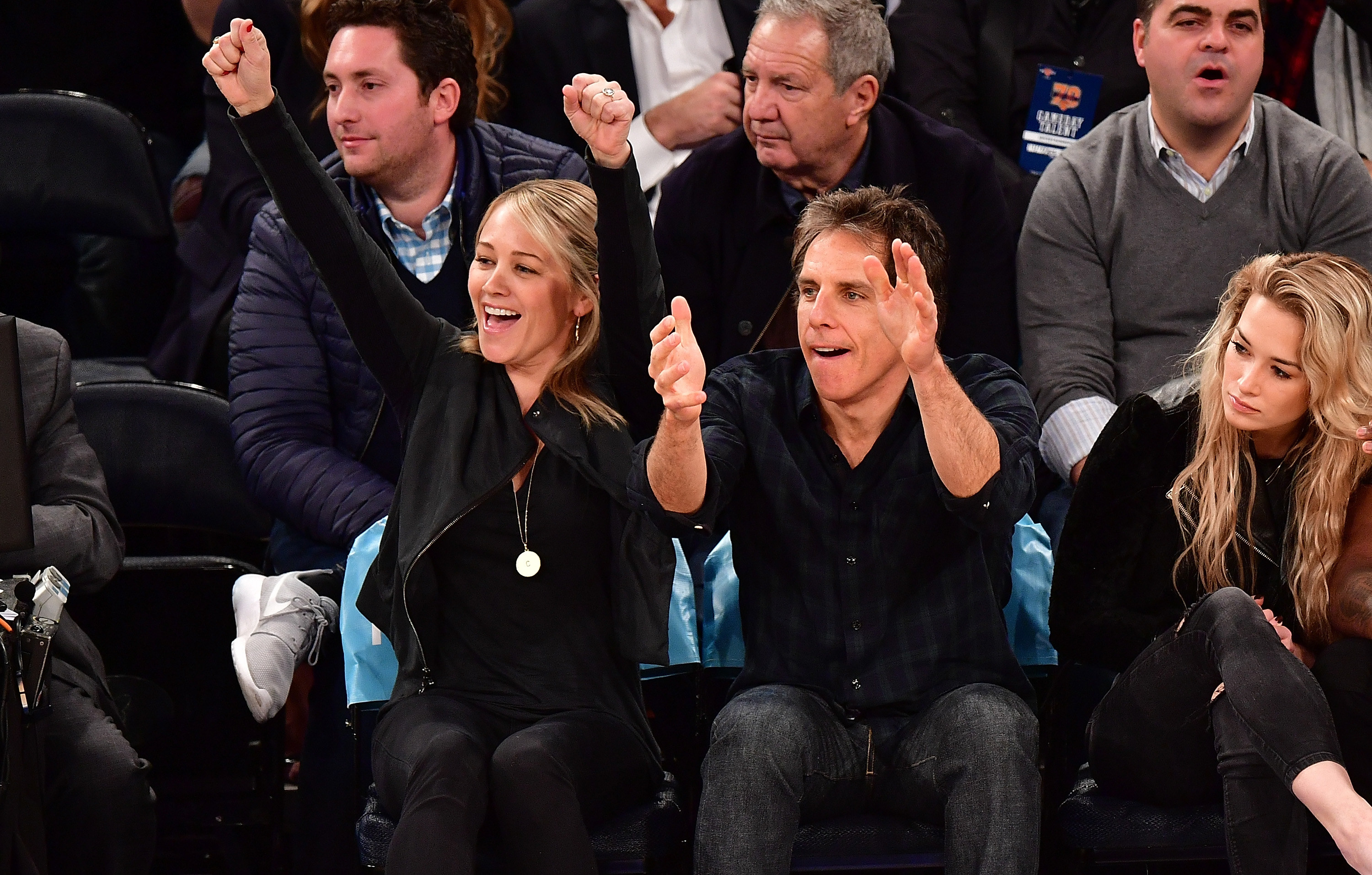 Christine and Ben cheer at a basketball game