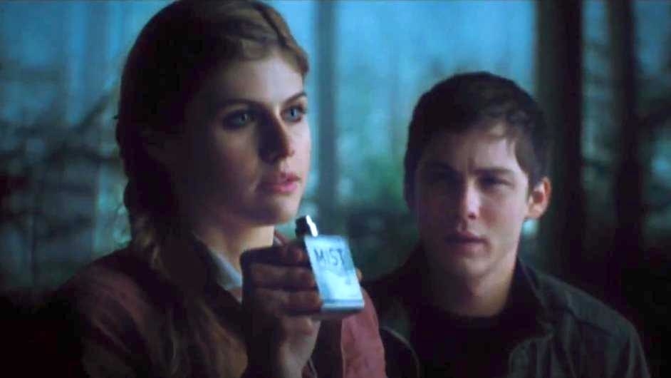 Alexandra Daddario as Annabeth and Logan Lerman as Percy Jackson standing in the woods. Annabeth is holding a spray bottle called &#x27;Mist&#x27;.