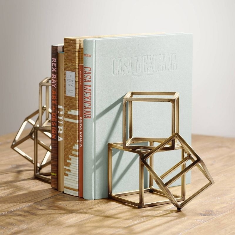 the block bookends against a row of books