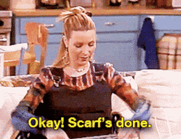 A gif of Phoebe from Friends putting a thin scarf around her neck and saying &quot;ok scarf&#x27;s done&quot;
