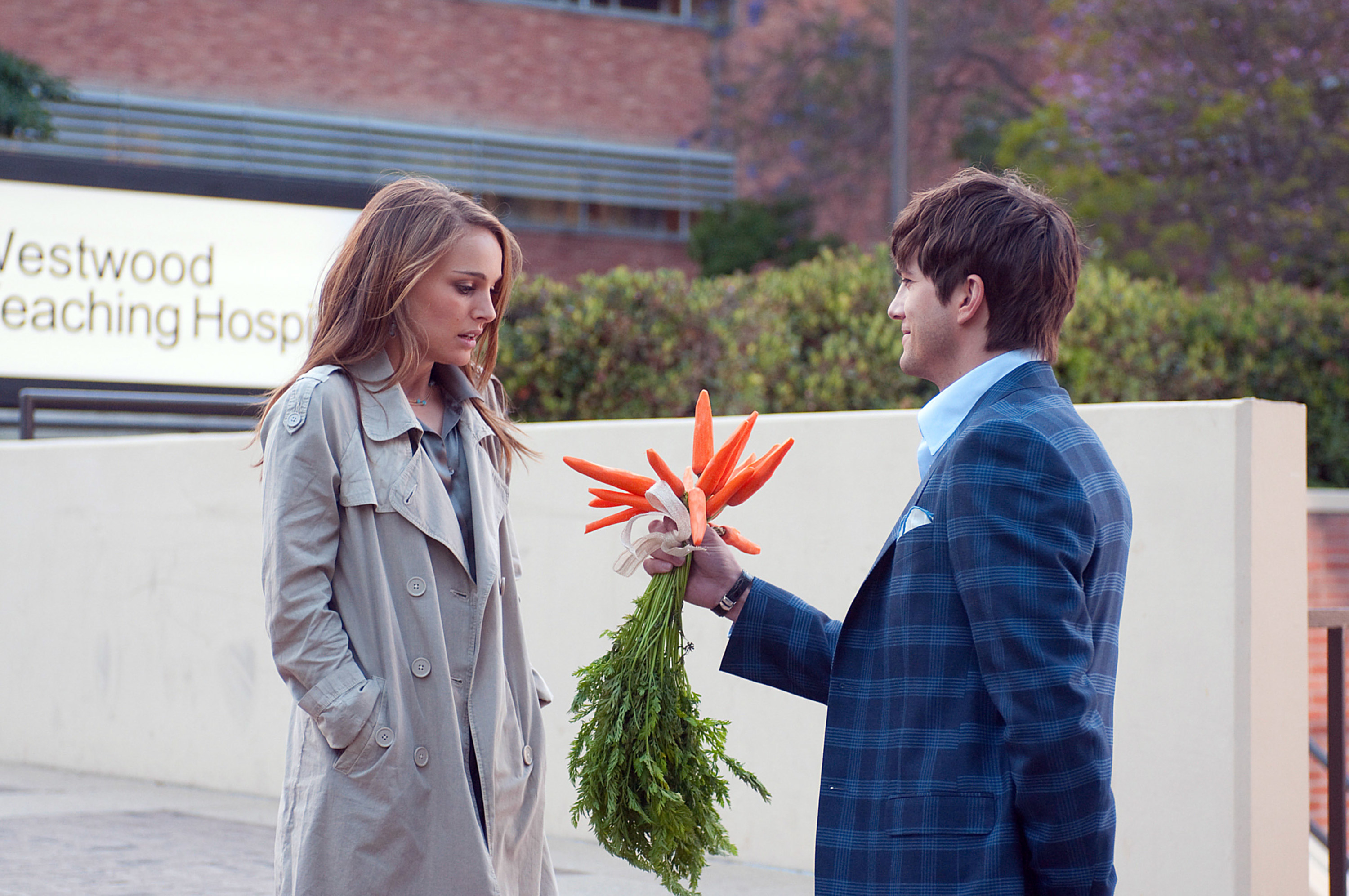 Emma appears unimpressed by the bouquet of carrots Adam offers her