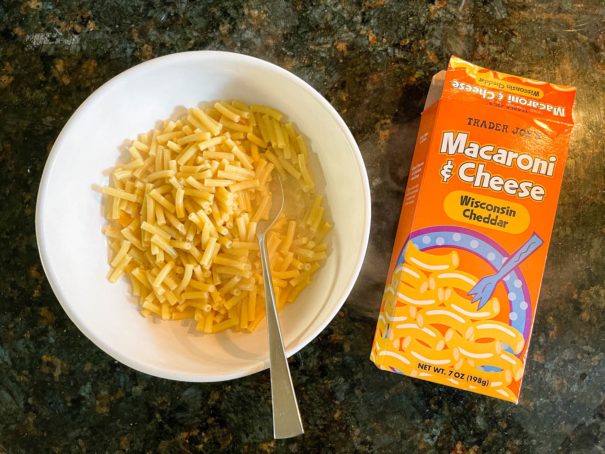 Bowl of Trader Joe&#x27;s macaroni &#x27;n&#x27; cheese next to its box