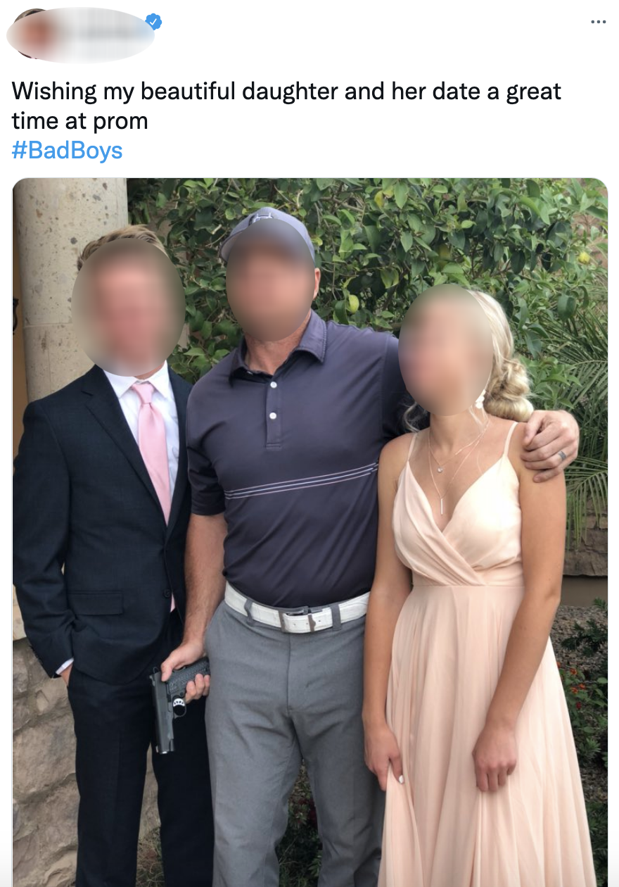 A tweet of a dad holding a handgun while posing with his daughter and her prom date that is hashtagged #BadBoys