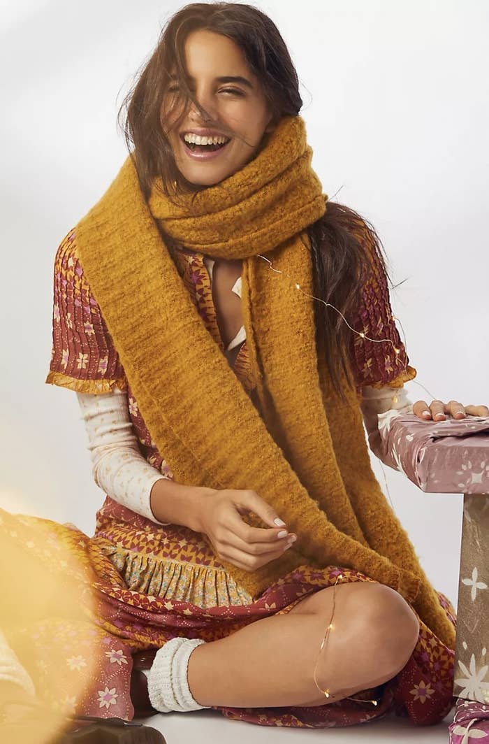Model wearing the mustard yellow scarf