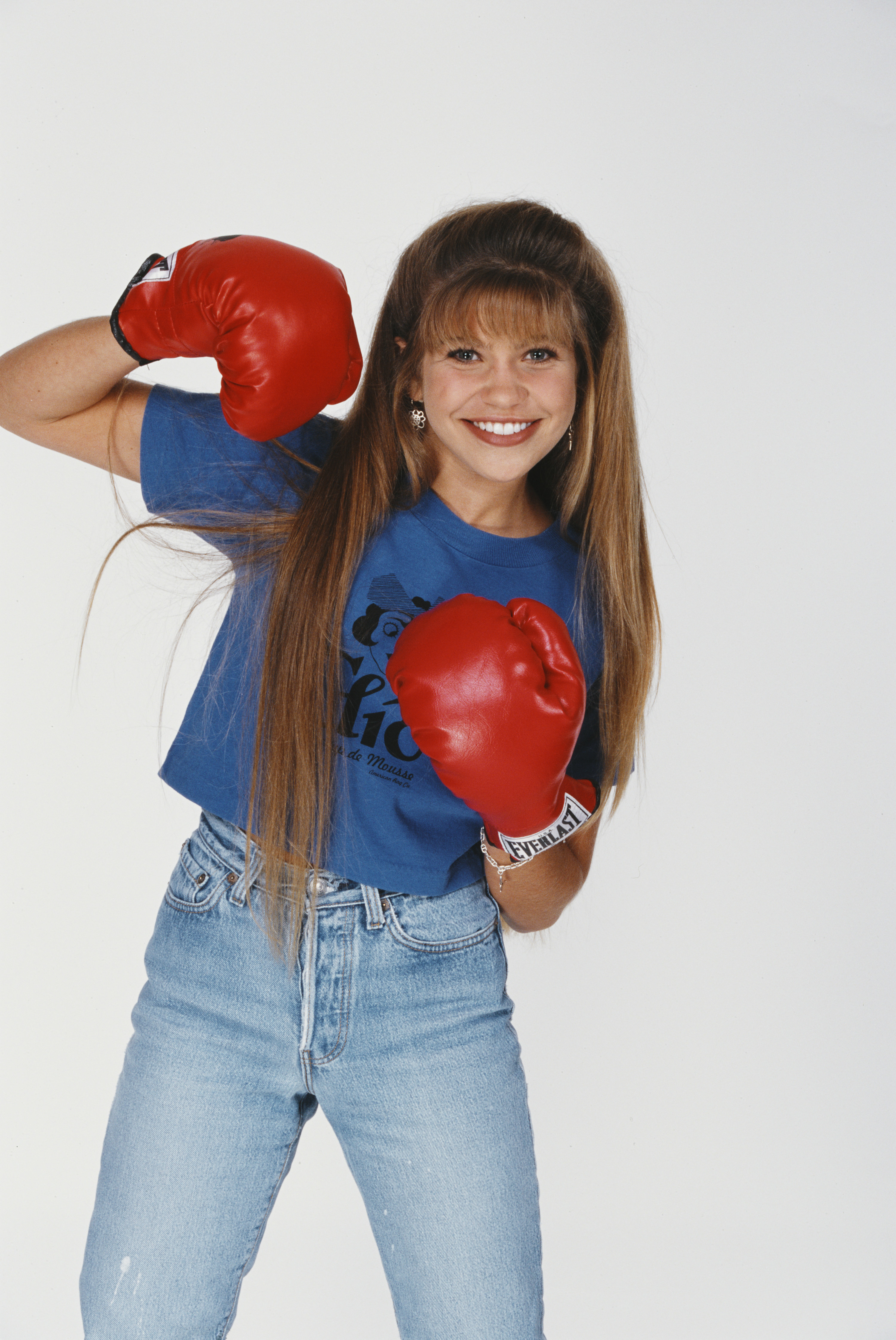 Danielle Fishel posing in boxing gloves in 1995