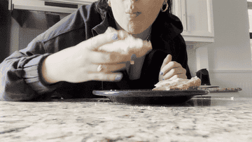 woman eating bagel