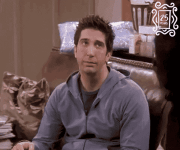 a gif of ross from friends slow clapping