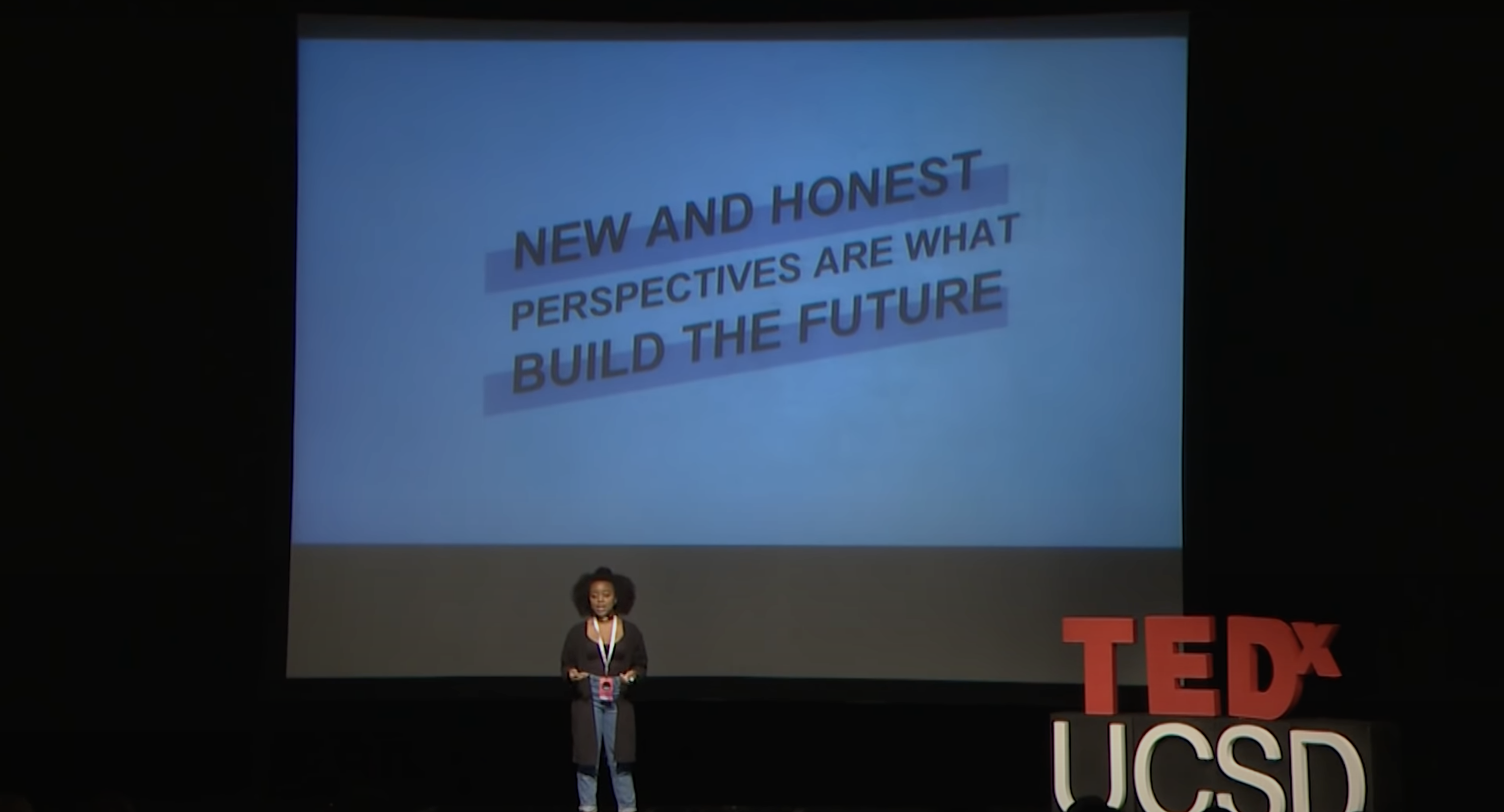 Quinta Brunson delivers a TEDx lecture at a university
