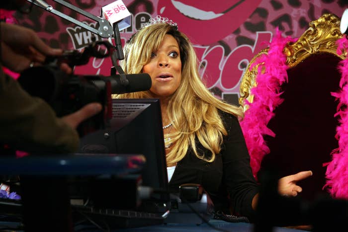 Wendy Williams sit in a radio booth. 
