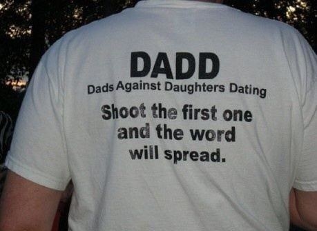 A man wearing a shirt that says &quot;DADD Dads Against Daughters Dating, shoot the first one and the word will spread&quot;