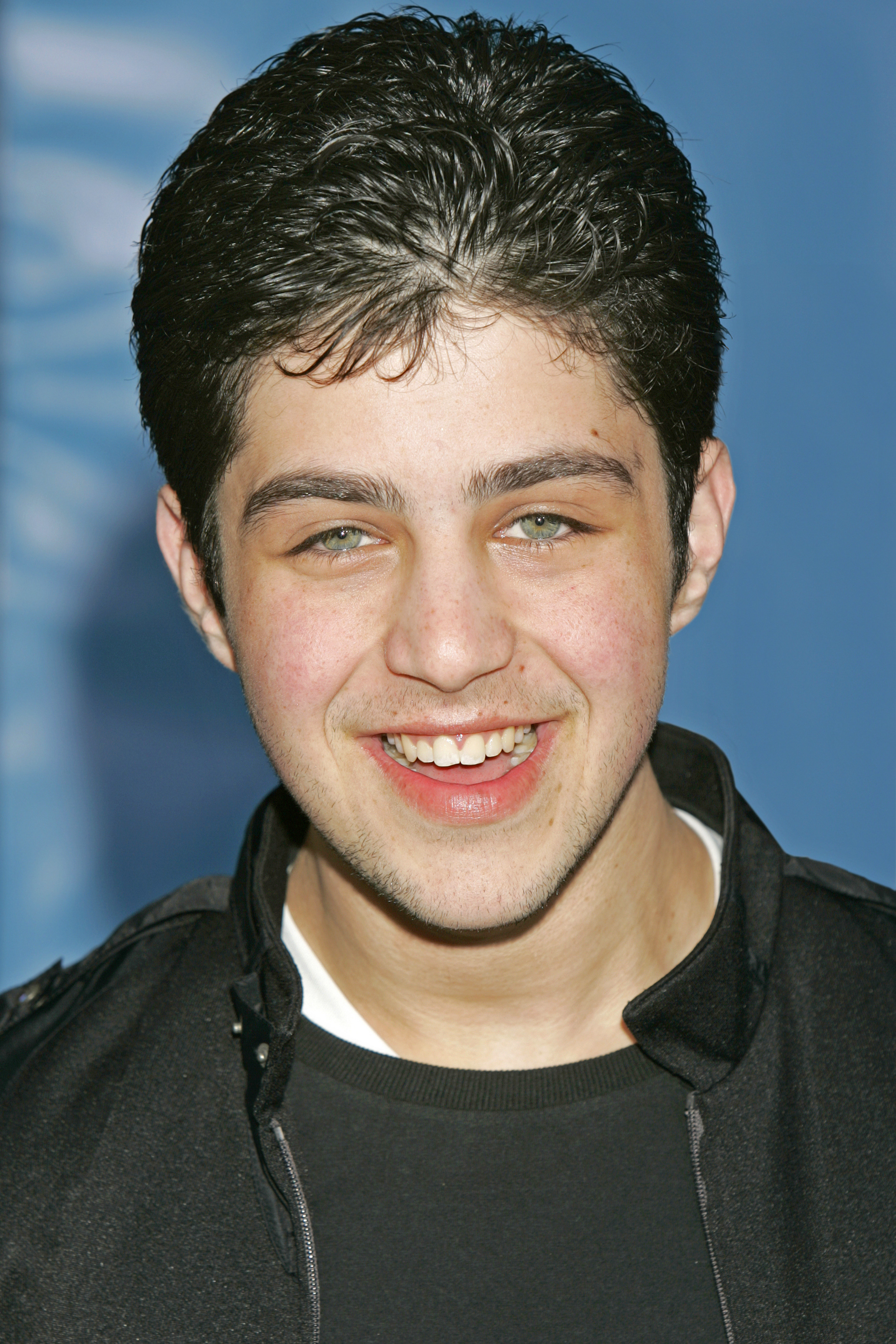 Josh Peck laughing at an event in 1998
