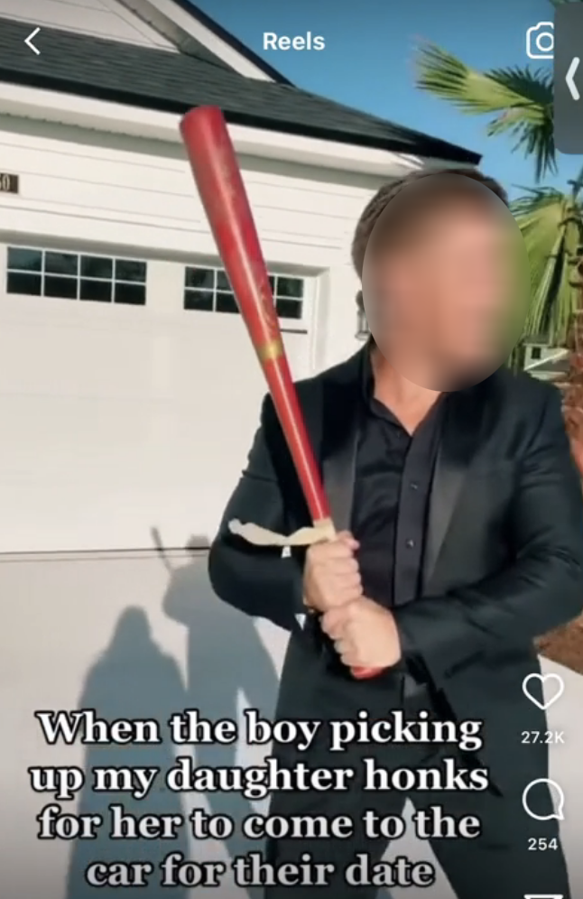 A screenshot of a TikTok video with a guy in a suit holding a bat and a caption that reads &quot;when the boy picking up my daughter honks for her to come to the car&quot;