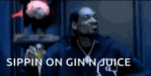 Snoop Dogg in his music video rapping, &quot;sipping on gin n juice&quot;