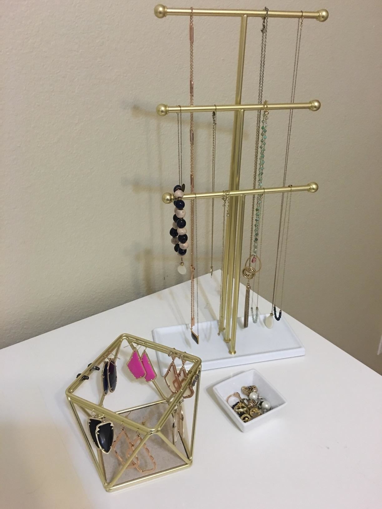 a reviewer photo of a three-tiered necklace rack