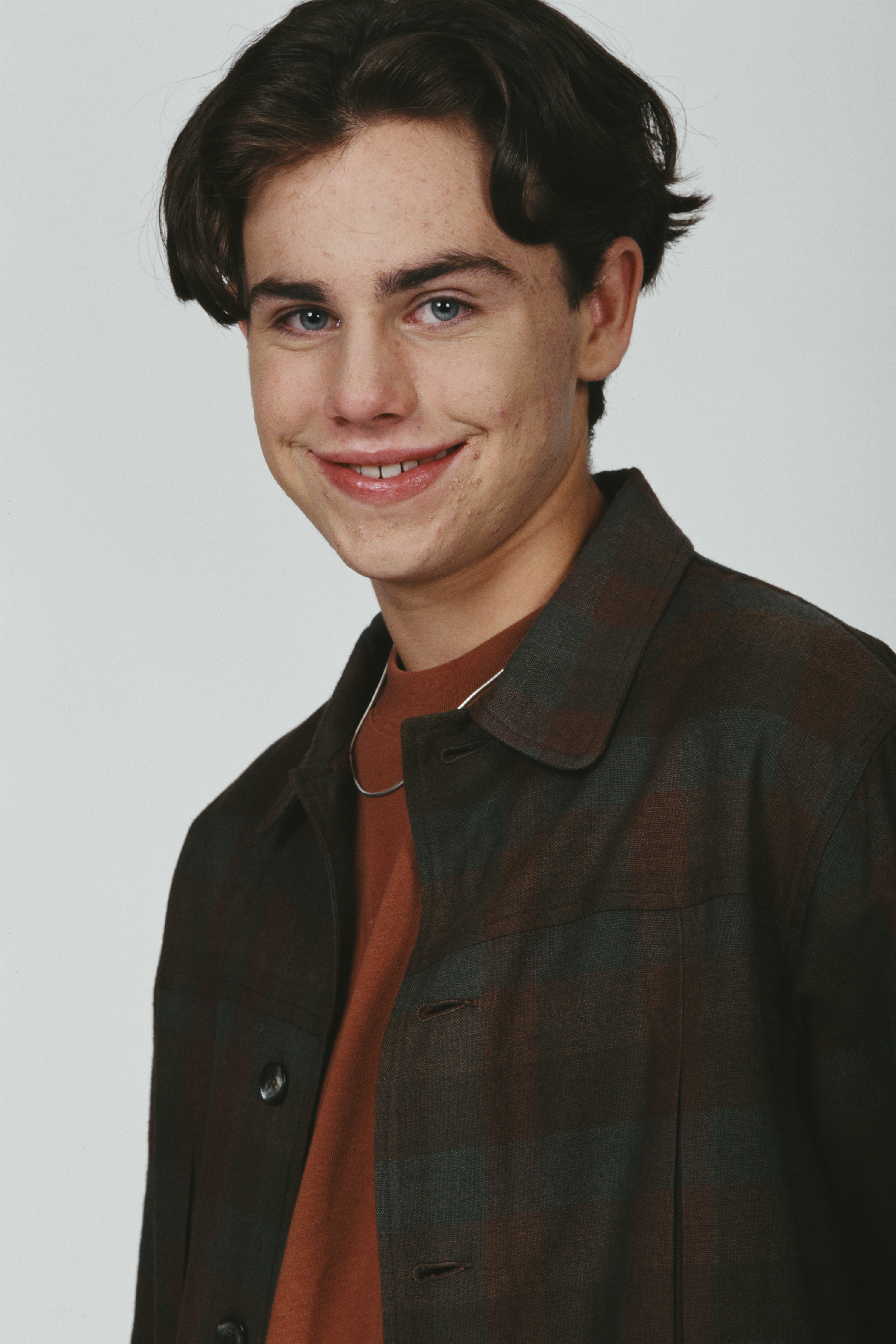 Rider Strong posing with a smile in 1995