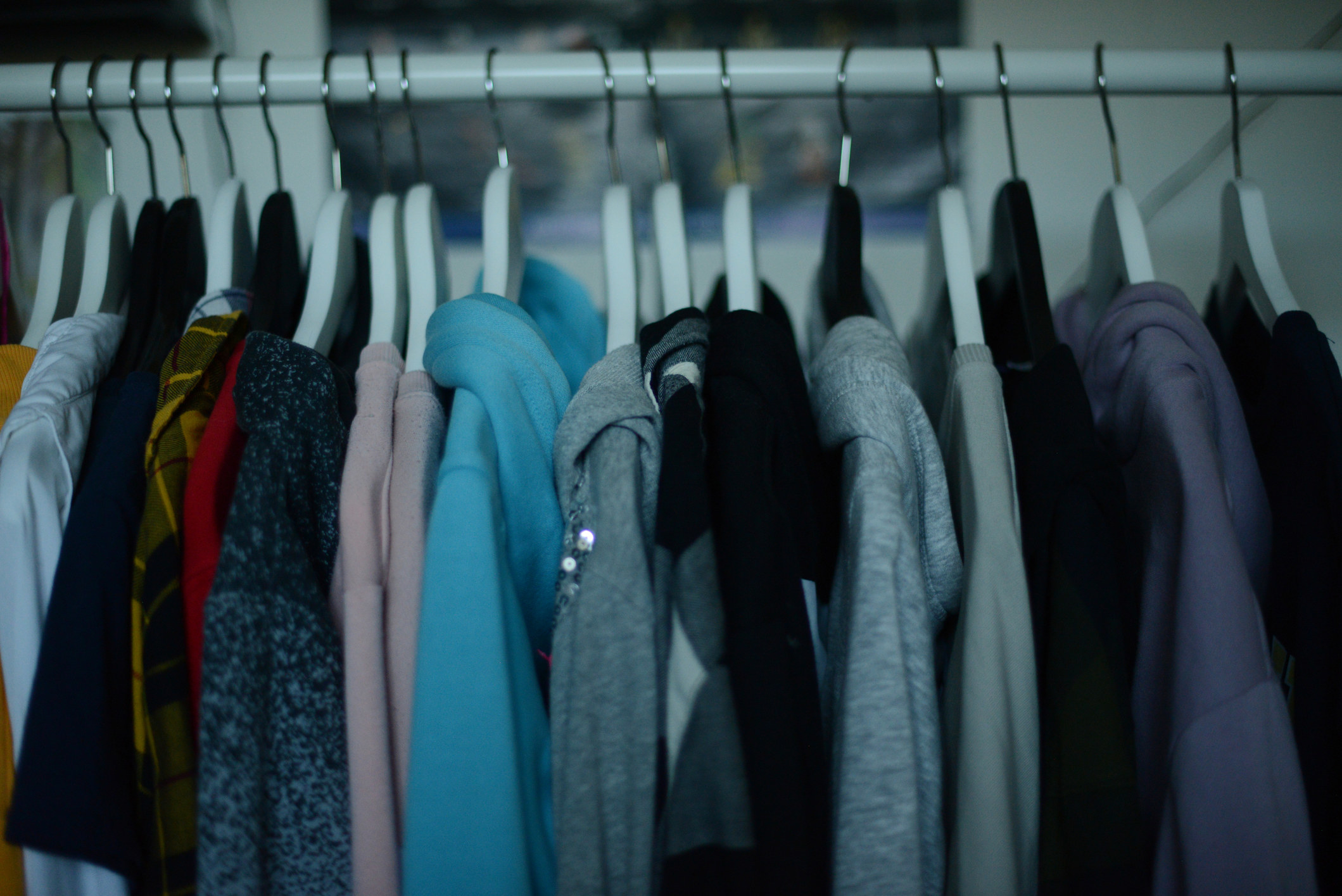 Close-up of closet rack of hoodies