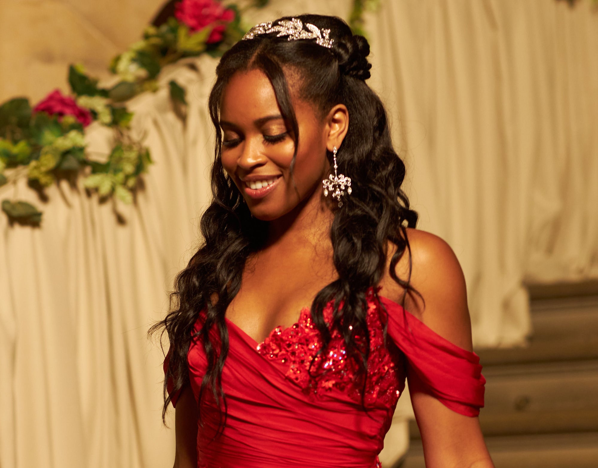 Rémy in a sweeping red gown