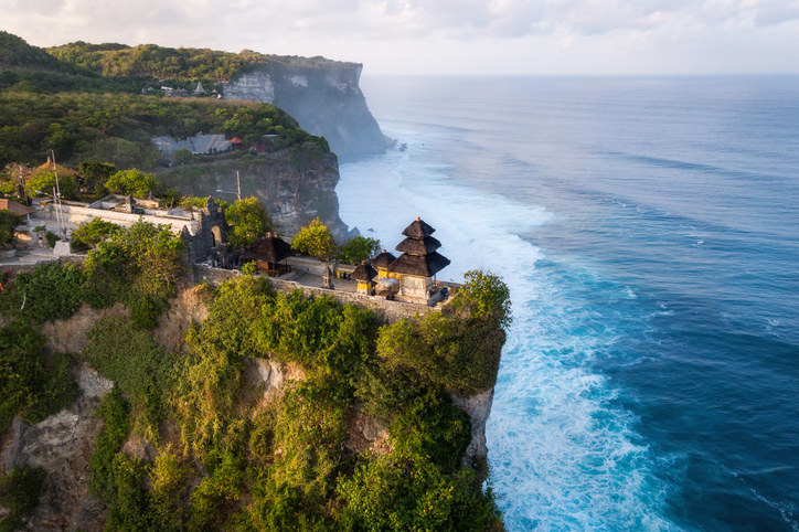 Temple on a cliff surrounded by the ocean