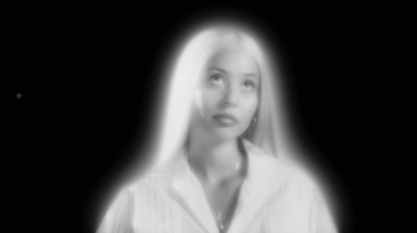 Alexa wearing a long blonde wig in her music video