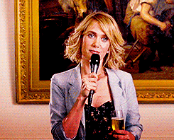 Kristen Wiig in Bridesmaids giving a knowing look during a speech