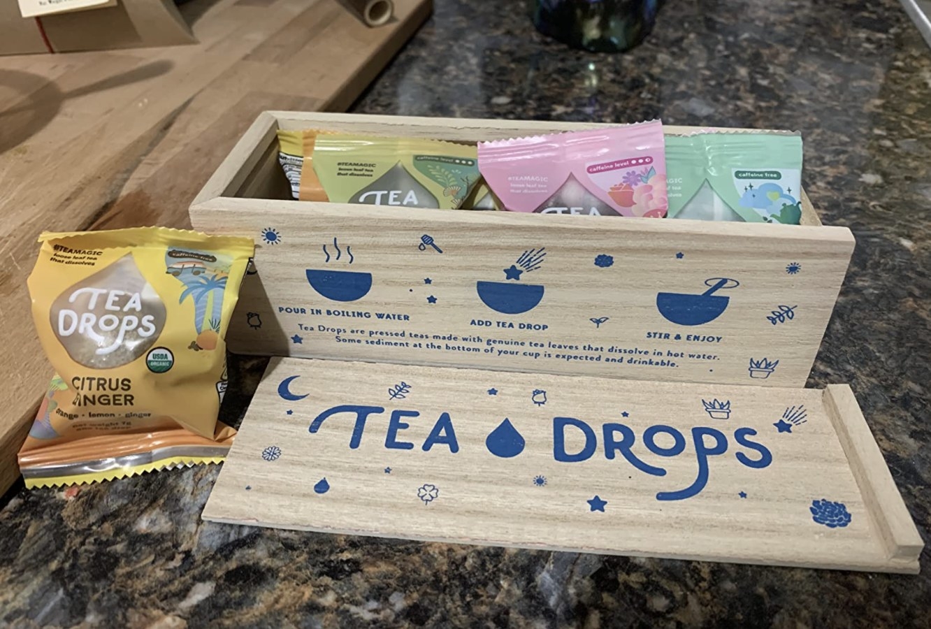 reviewer photo showing the Tea Drops sampler set and its packaging