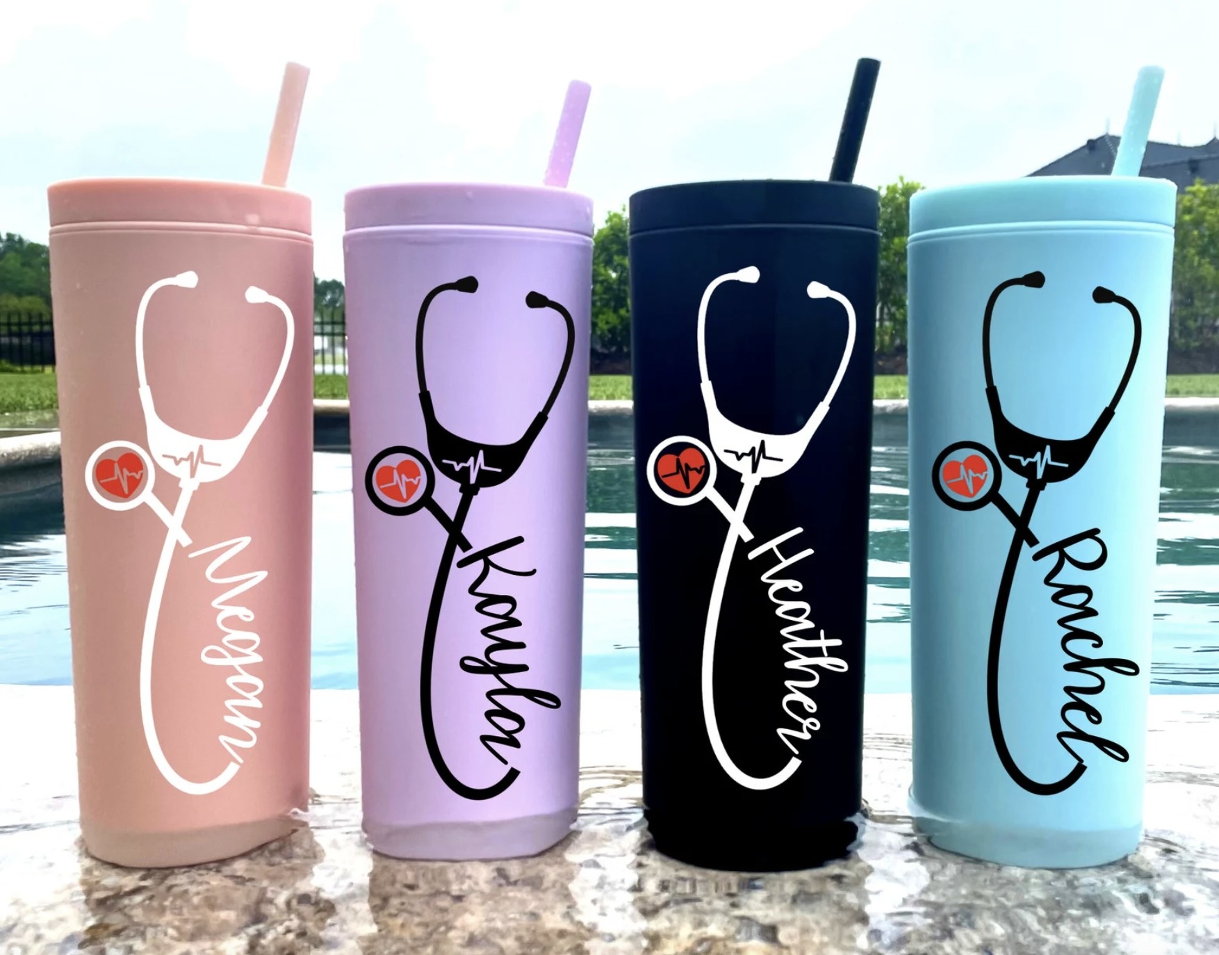 four of the nurse-inspired tumblers in different colors and customized with different names