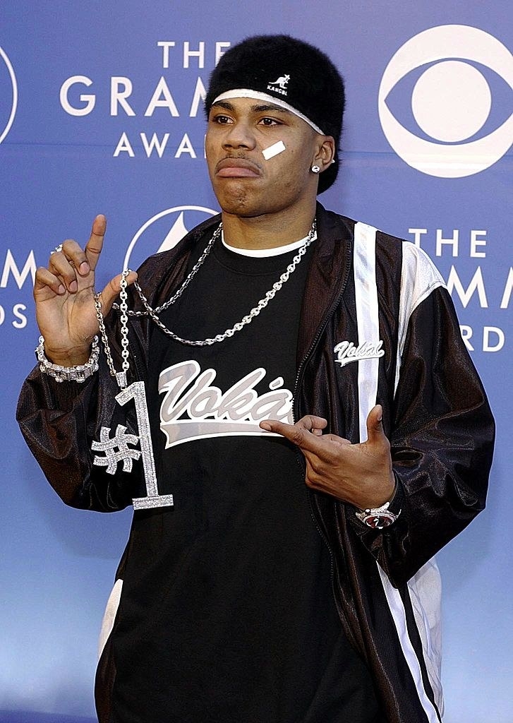Nelly sporting Band-Aids on his cheek at an event