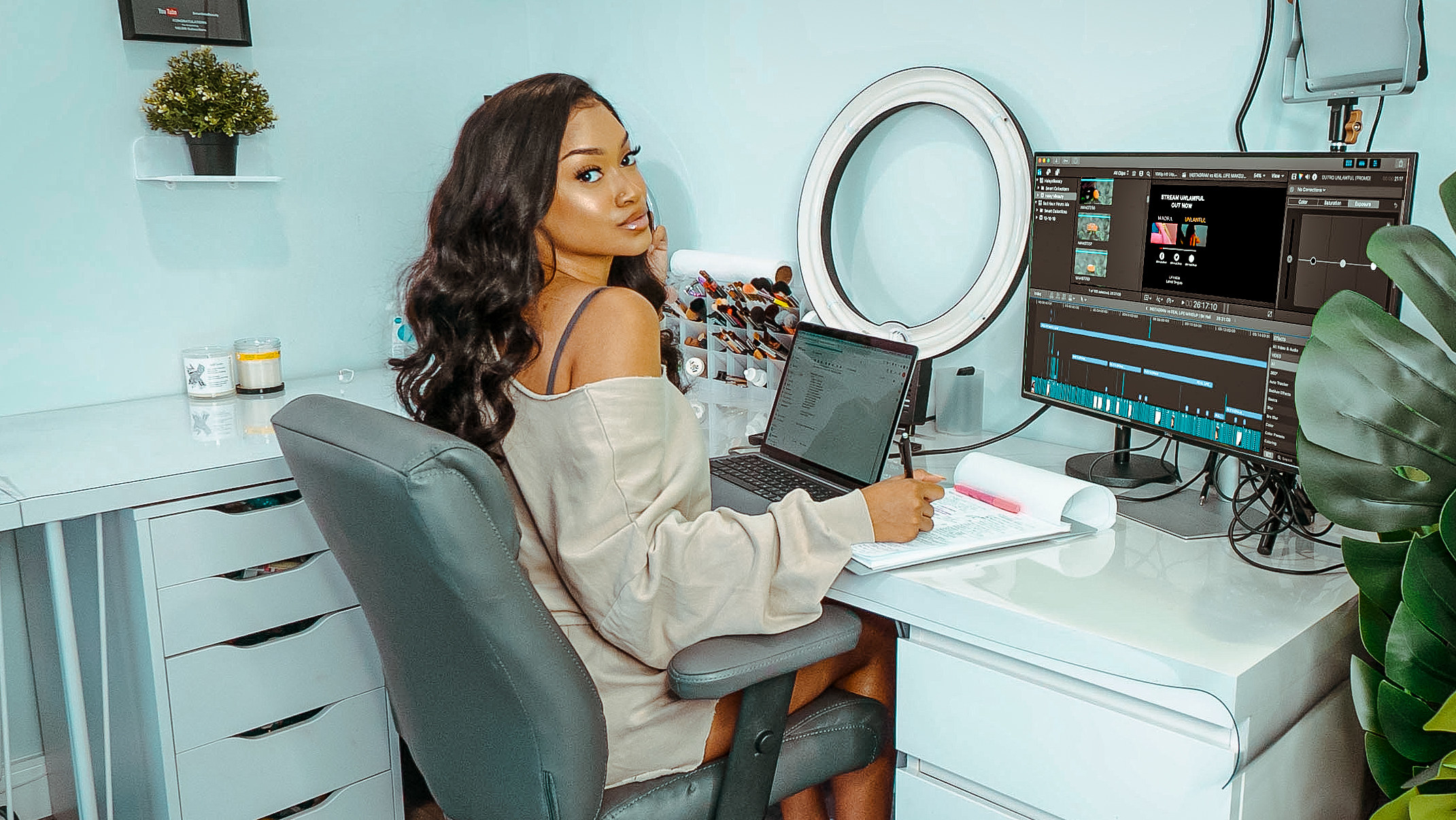 picture of woman at desk with computer and ringlight