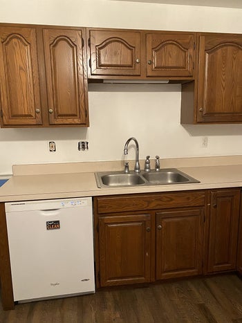 reviewer image of their brown cabinets before
