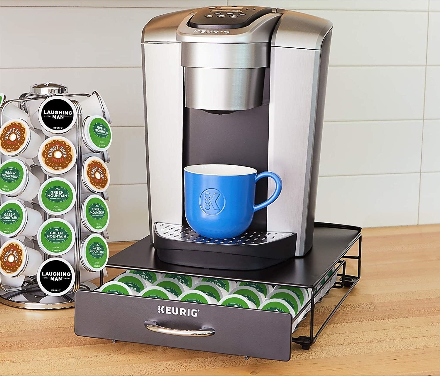 A Keurig coffee maker on a small drawer filled with coffee pods