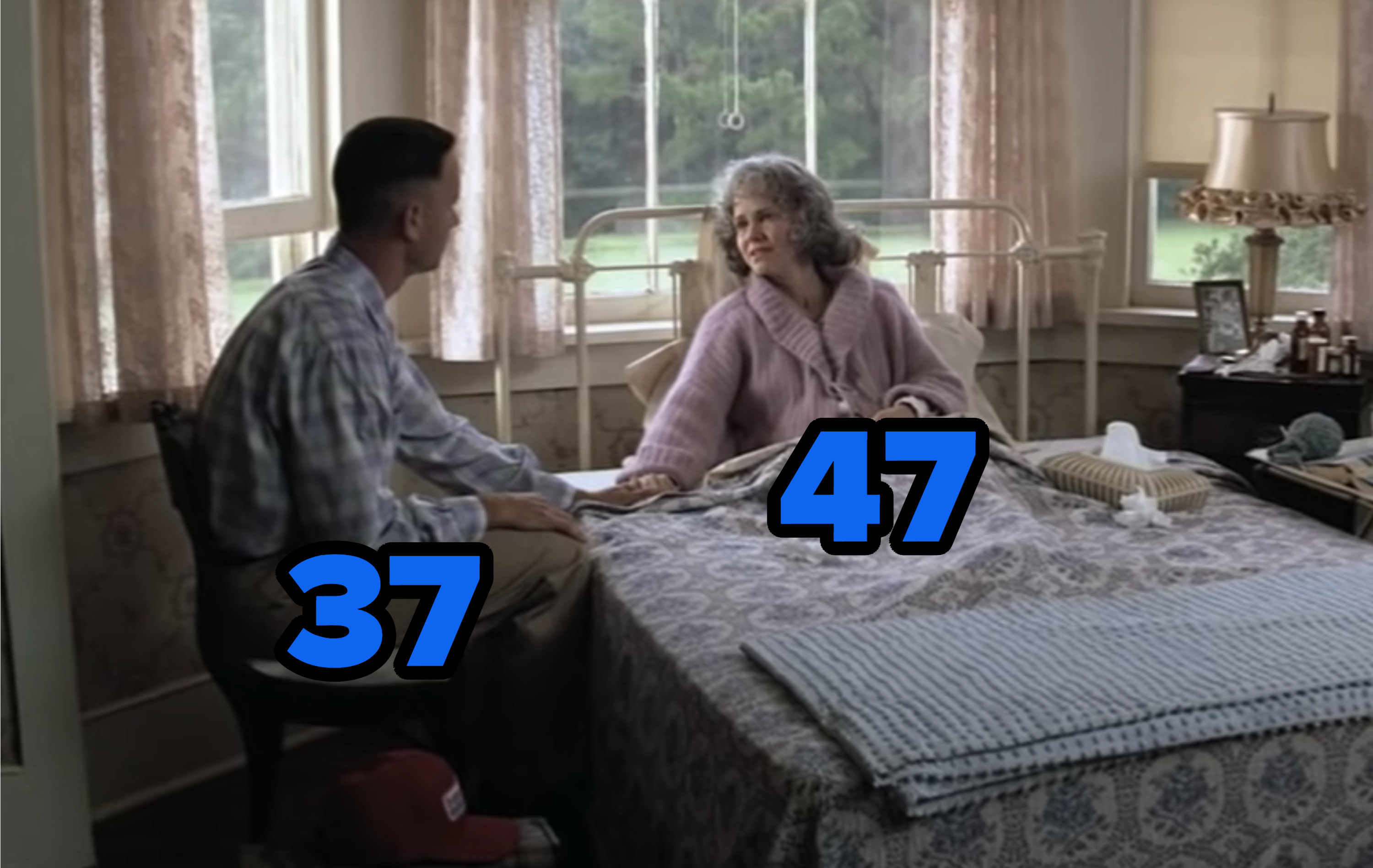 Still from the movie with Tom Hanks and Sally Field holding hands while she's on her sick bed