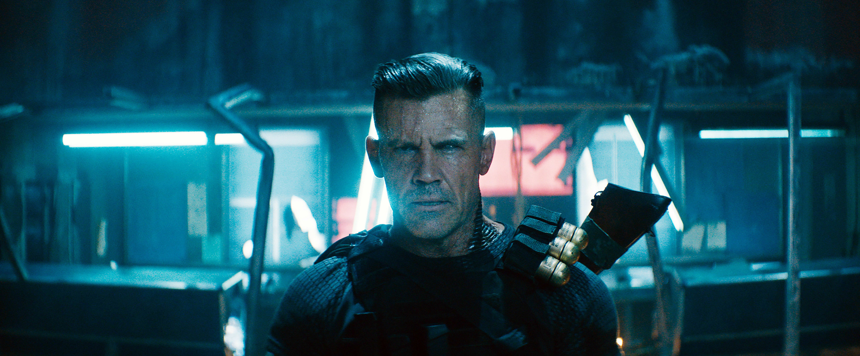 wearing his weapons, Cable stares directly into the camera