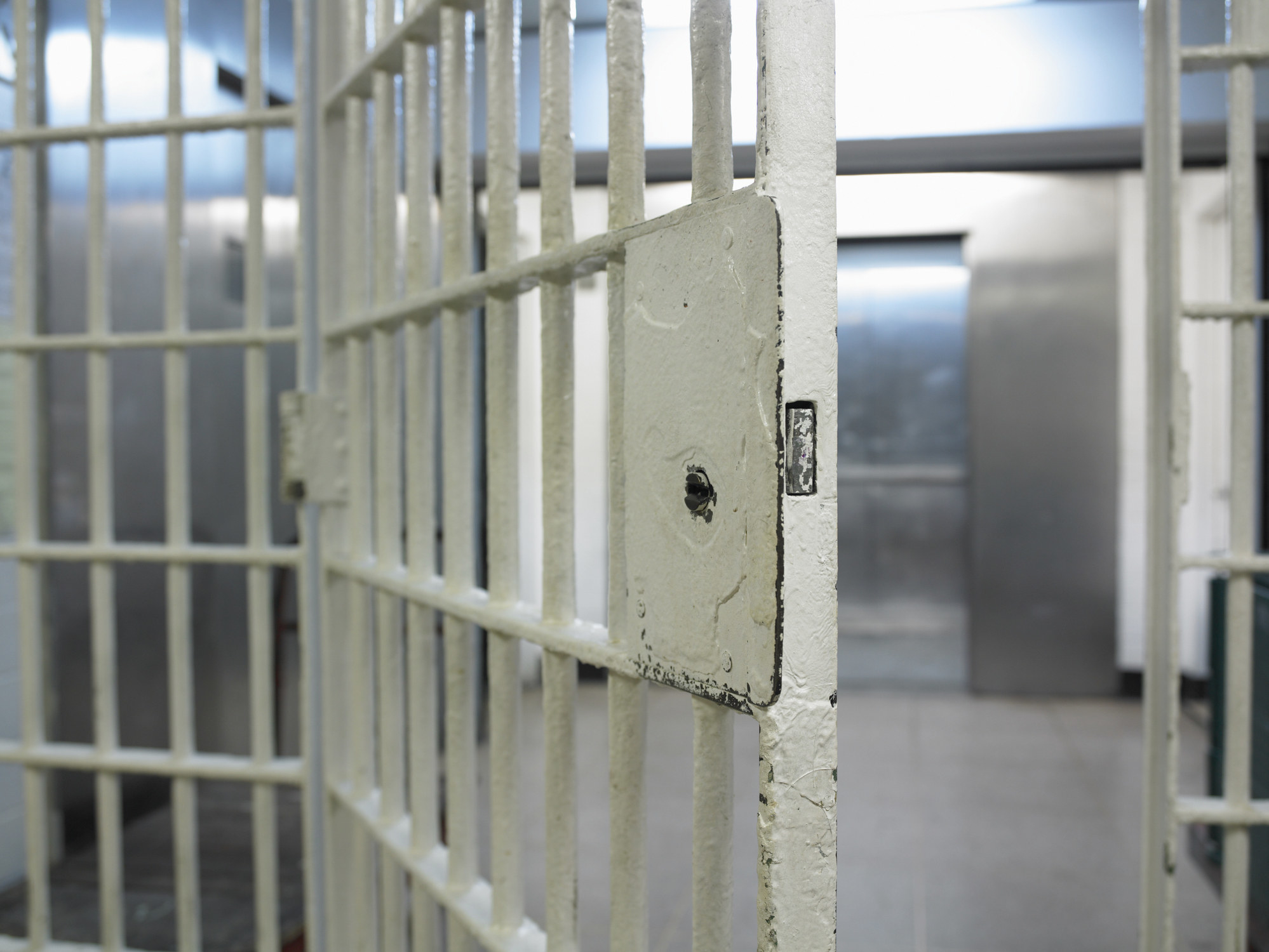 Rusty prison bars in an open prison cell