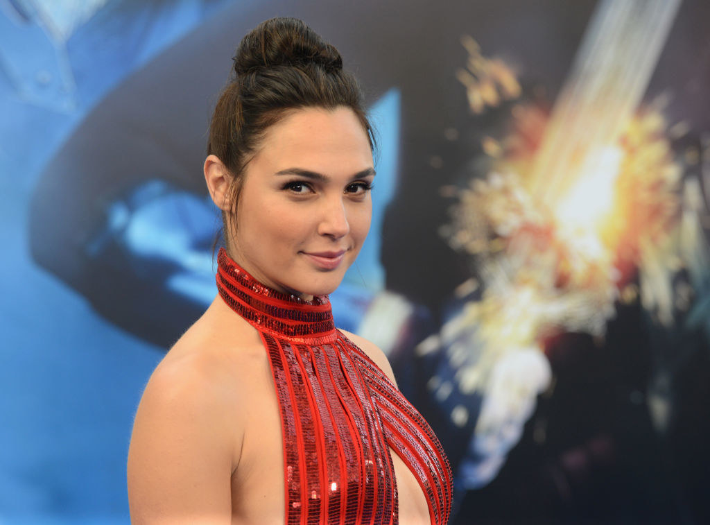 Gal with her hair in a bun and wearing a halter top