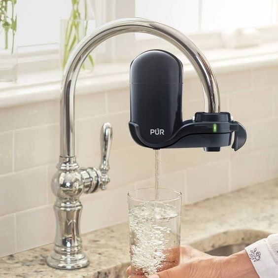 black PUR faucet filter on faucet