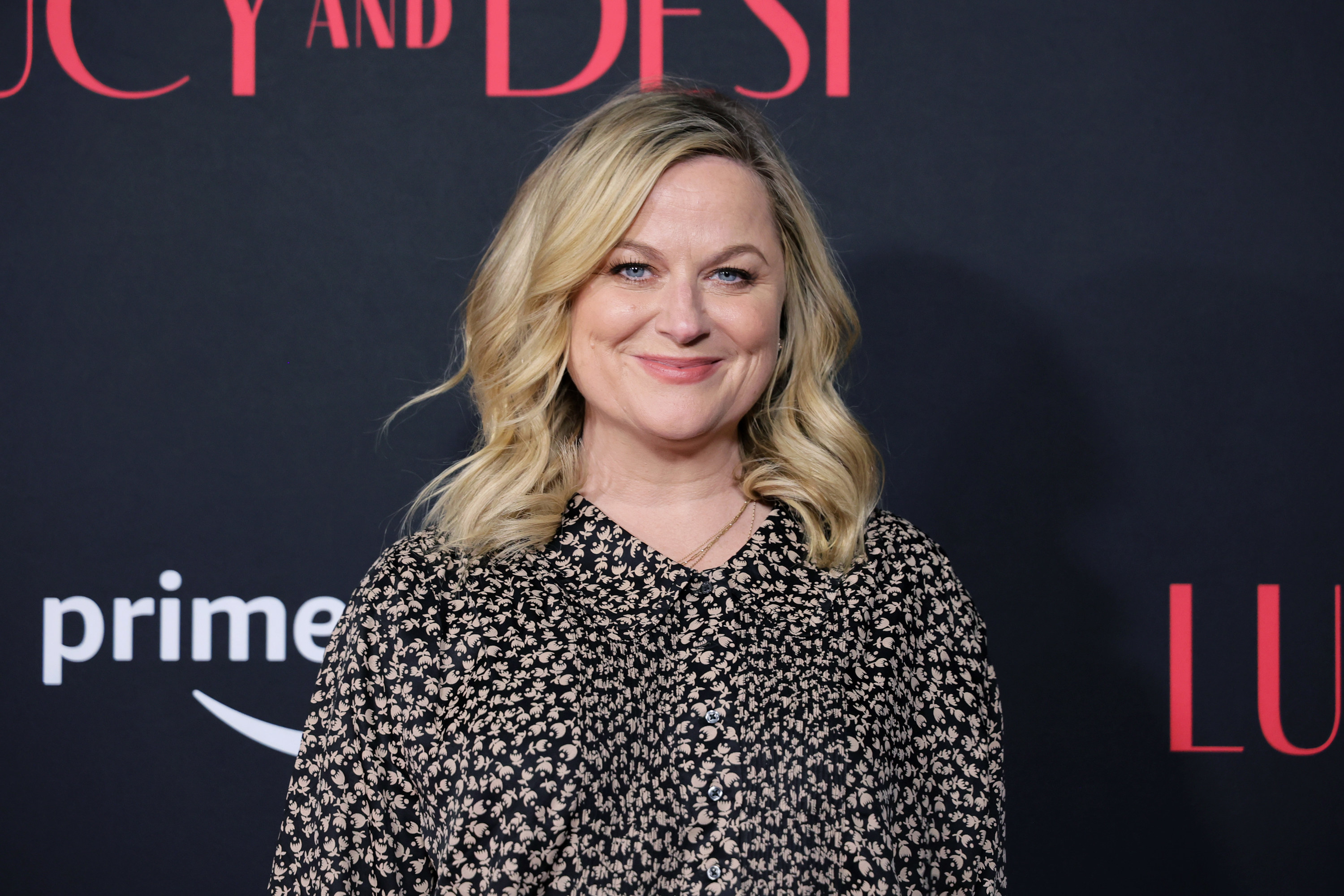 Amy Poehler smiles at the &quot;Lucy and Desi&quot; premiere in Los Angeles
