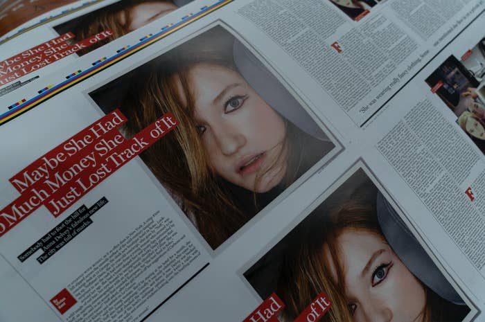 A newspaper with the the headline "Maybe She Had So Much Money She Just Lost Track of It" with a woman's face pictured next to the words